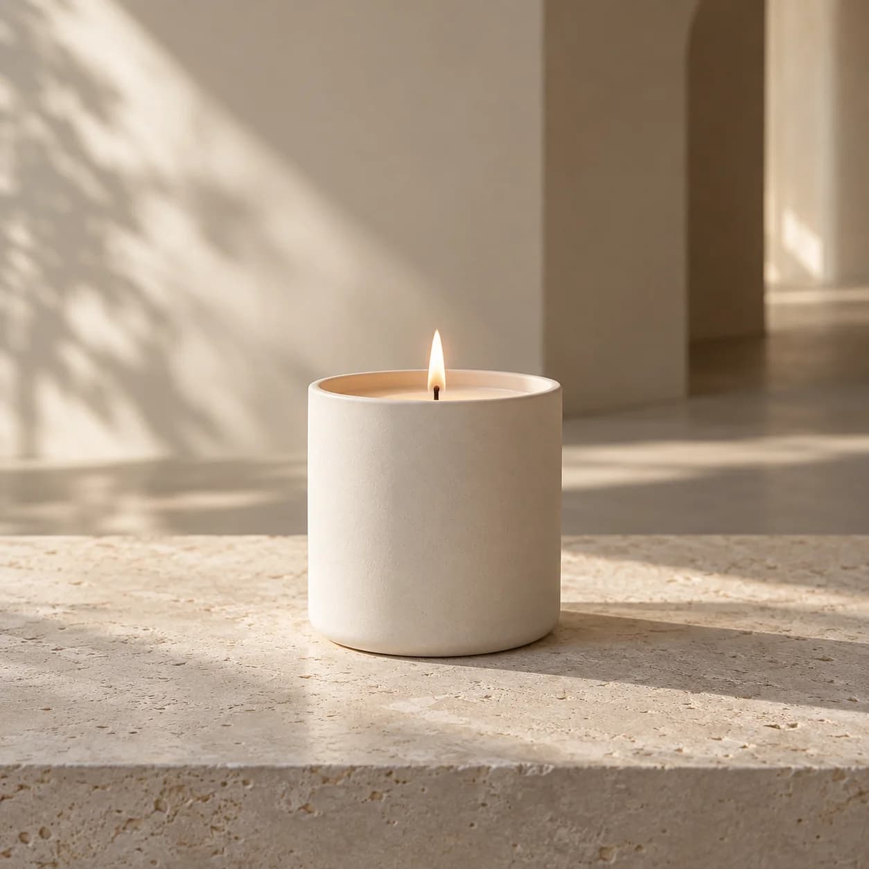 Candlelight on a quiet stone surface — an editorial still life